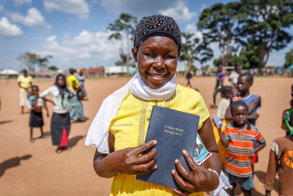 Woman holding her Bible.