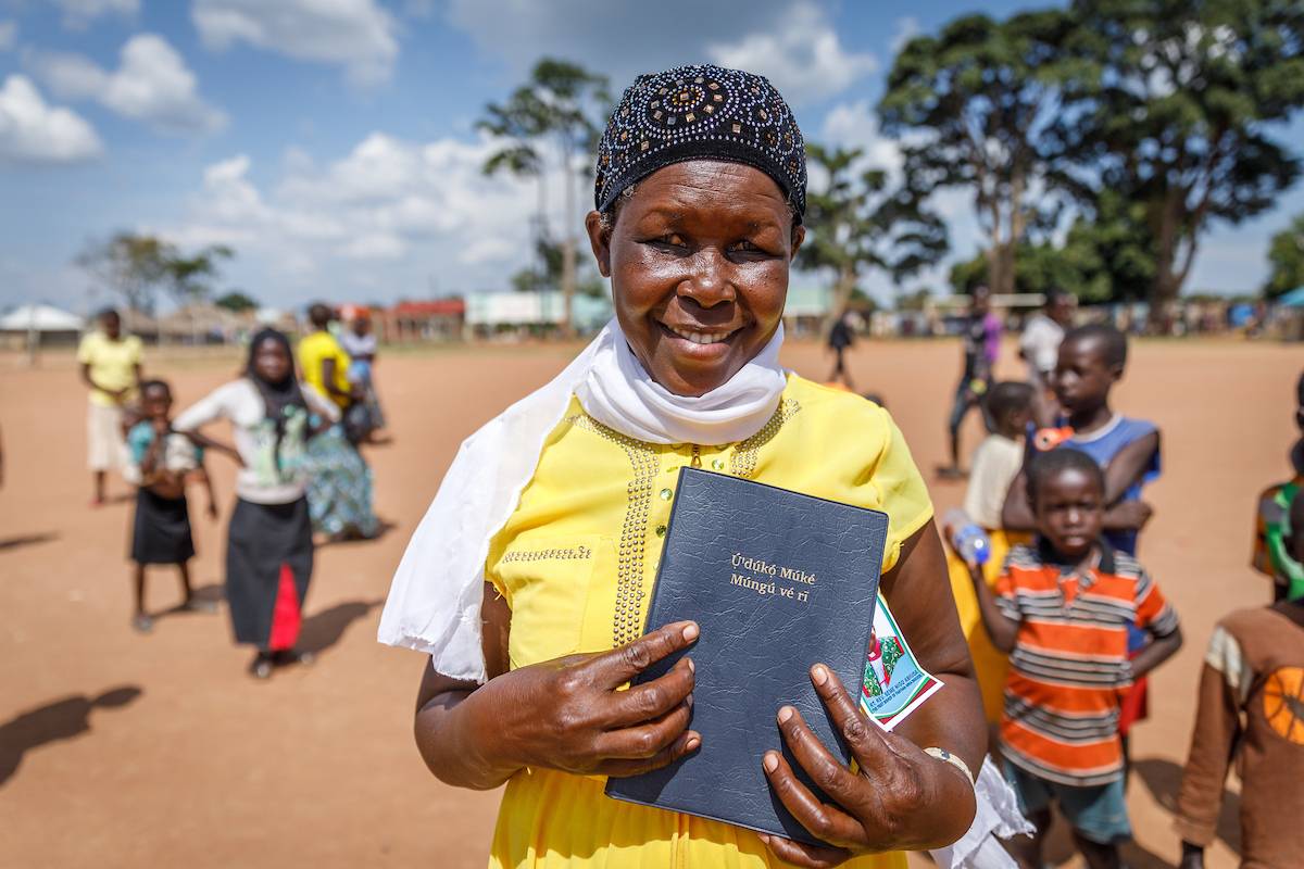 Woman holding her Bible.