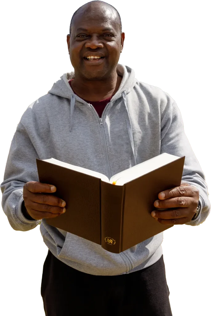 Man with Bible in a field