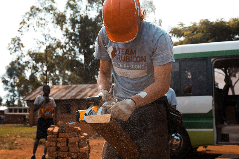 volunteer builder with a hard hat on