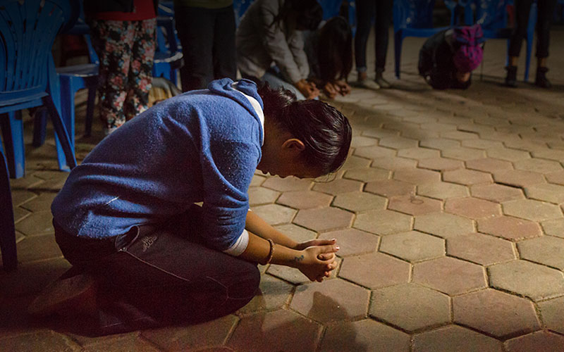 girl on knees, praying