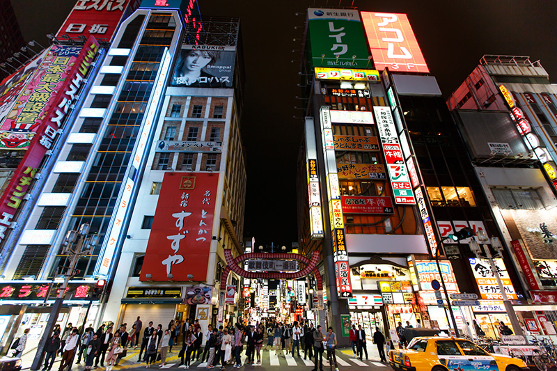 Asian city street with buildings.