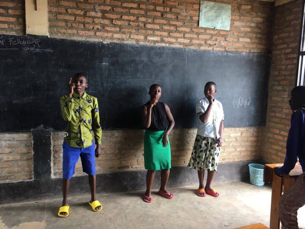 Using Rwandan Sign Language.