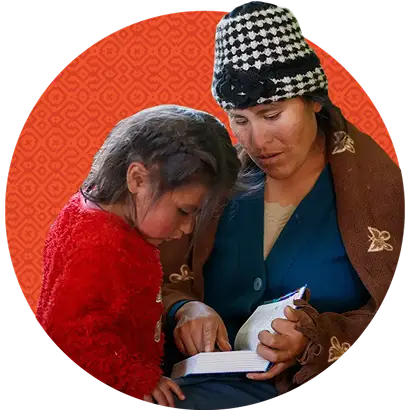 Mom with her young daughter reading the Bible