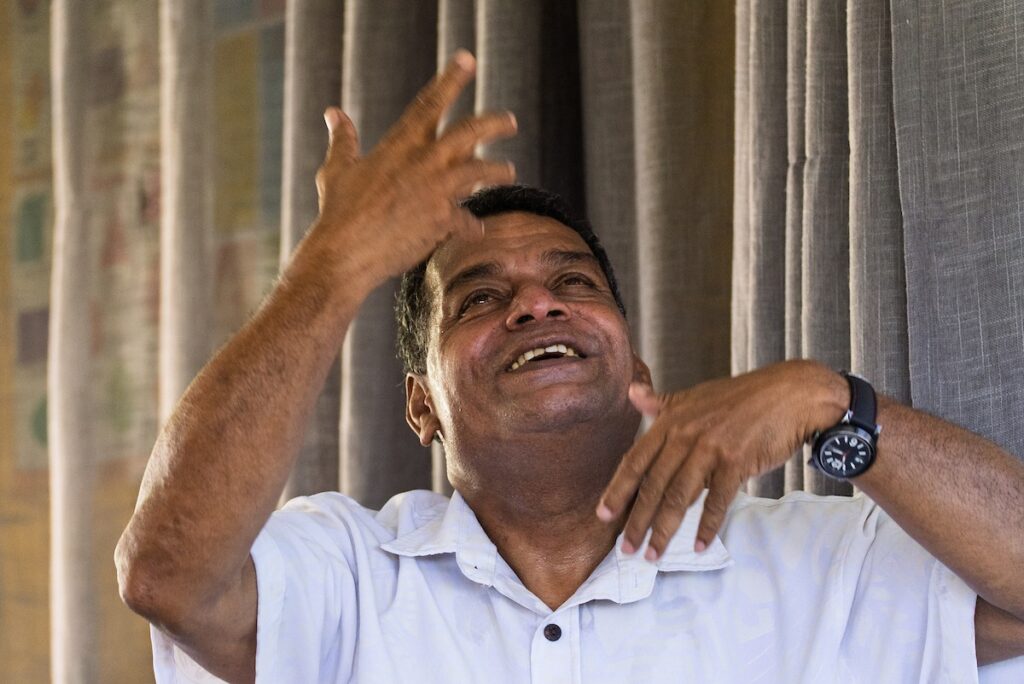 A Deaf pastor preaches to his congregation.