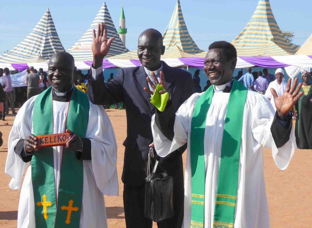 Translators and pastors Ezekiah Dada, Isaac Kenyi and Enos Dada celebrate the completed Keliko New Testament. 