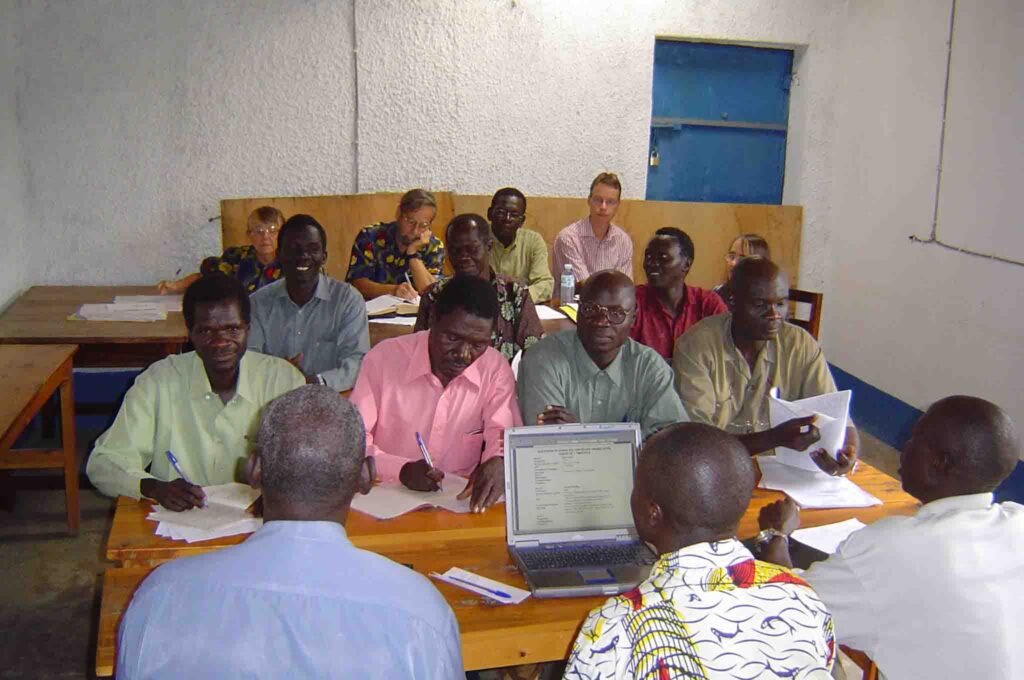 May 2006: Consultants Joy and John Anderson (back row, left) work with the team to check 1-2 Timothy.