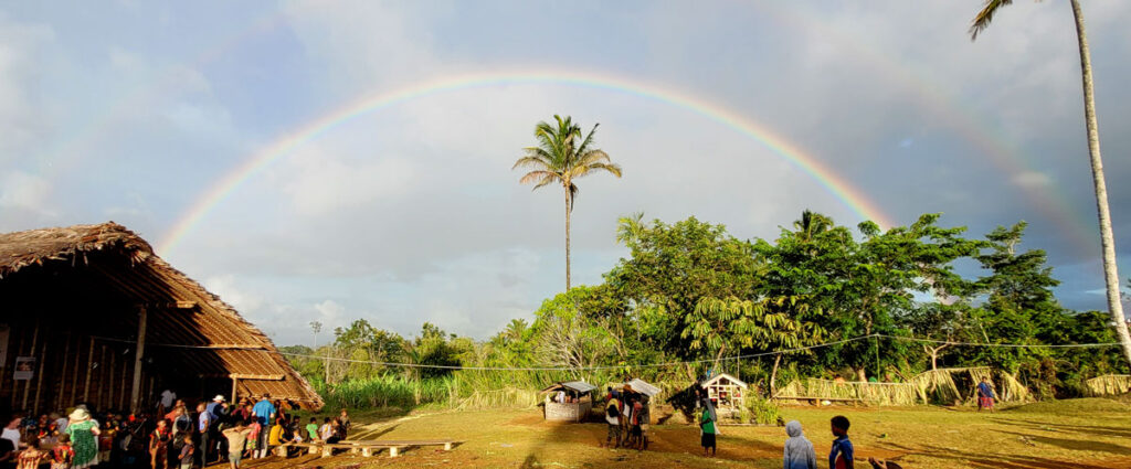 rainbow over village