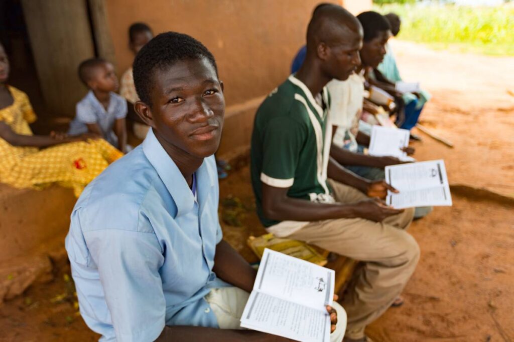 Young people in Ghana participate in a literacy class.