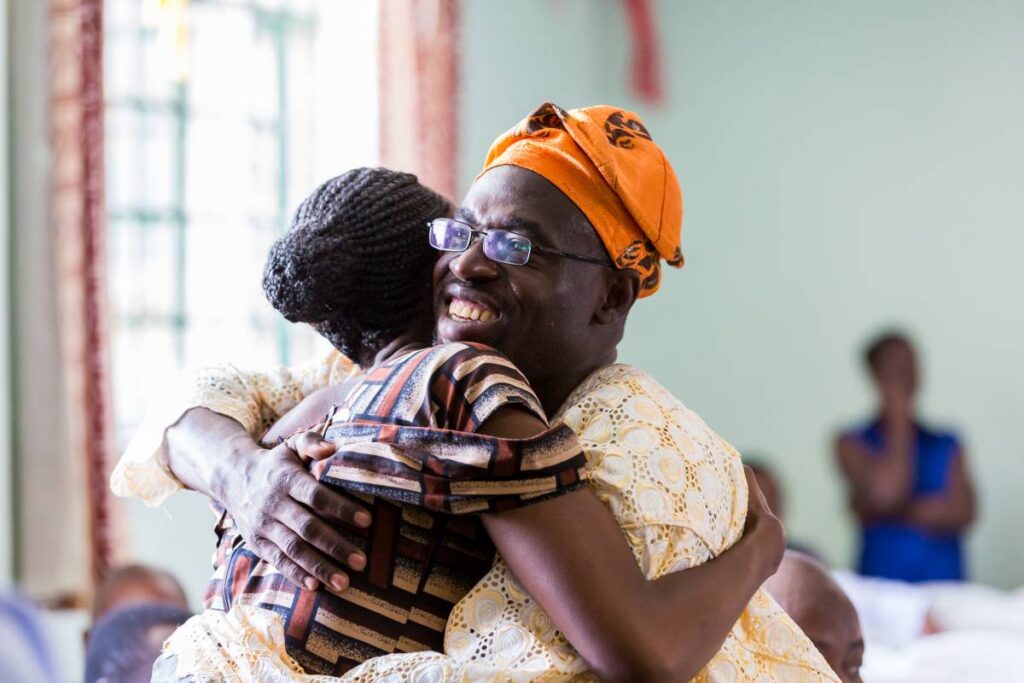Two people hugging.